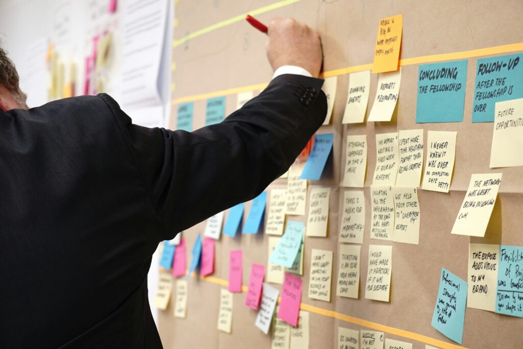 How To Boost Audience Engagement At Panel Discussions 2 Building Goals And Objectives For Panel Discussions With A Board And PostIt Notes